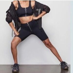 Good American Zip Up Warrior Bike Shorts in Black